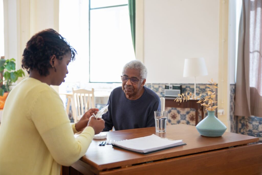 Owner of a senior home care business helps a client with care planning