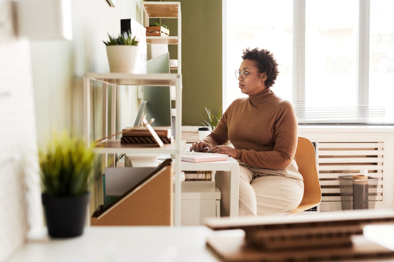 Female entrepreneur calculates the senior care franchise cost to start a home care business
